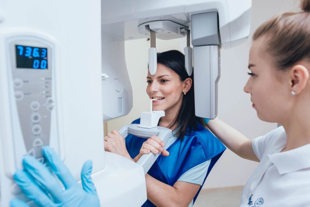 Patient receiving panoramic dental X-ray imaging general dentistry in Panama City, FL