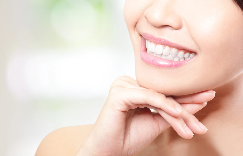 Smiling woman showing bright teeth cosmetic dentistry in Panama City, FL