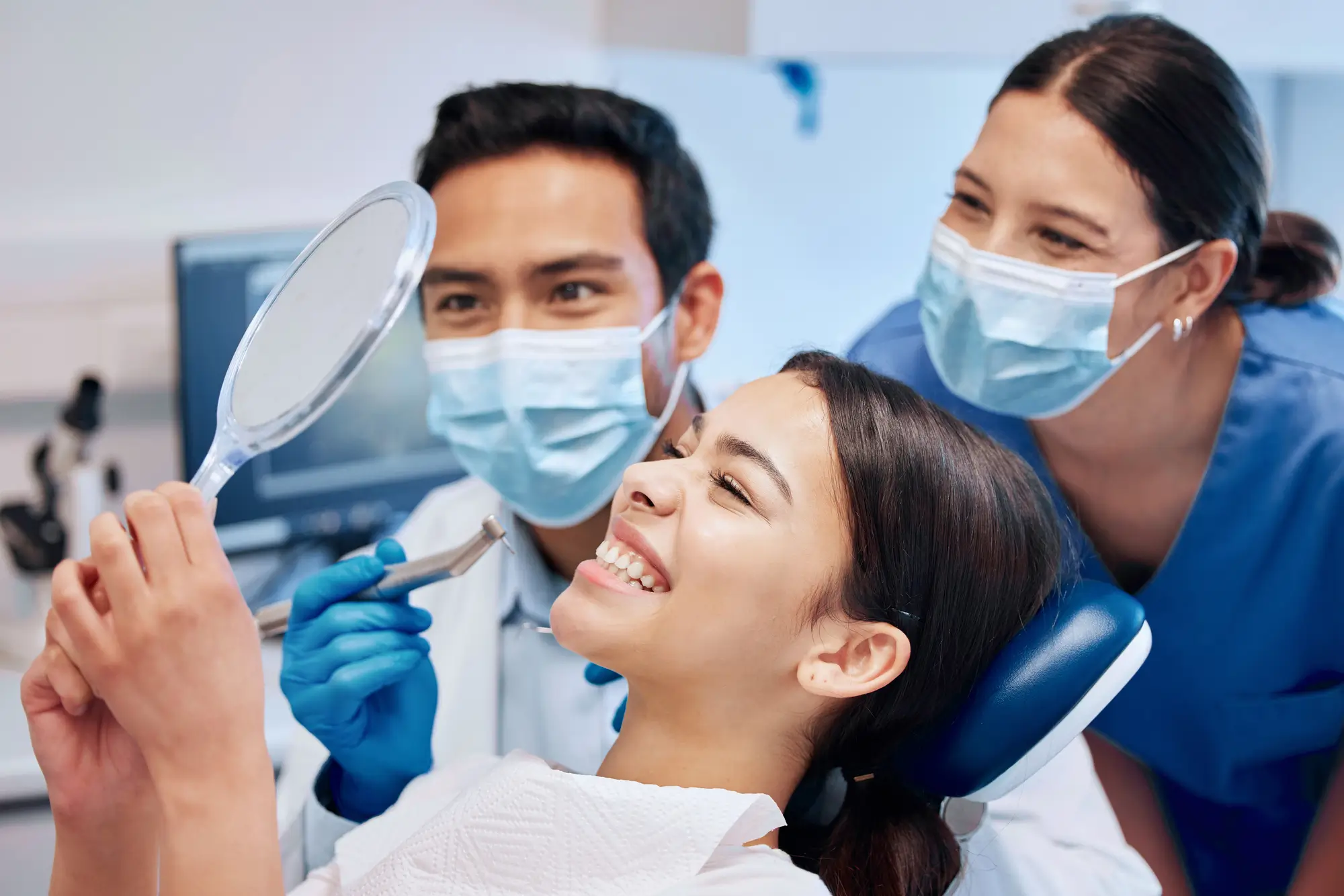 Woman Checking Her Smile at Dentist Lynn Haven FL